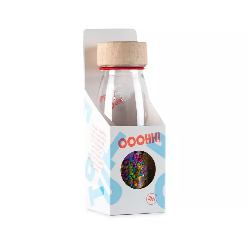 petit boum sensorische fles gevuld mit kleurrijke rijst en buttons om kinderen te laten schudden, luisteren en ontdekken