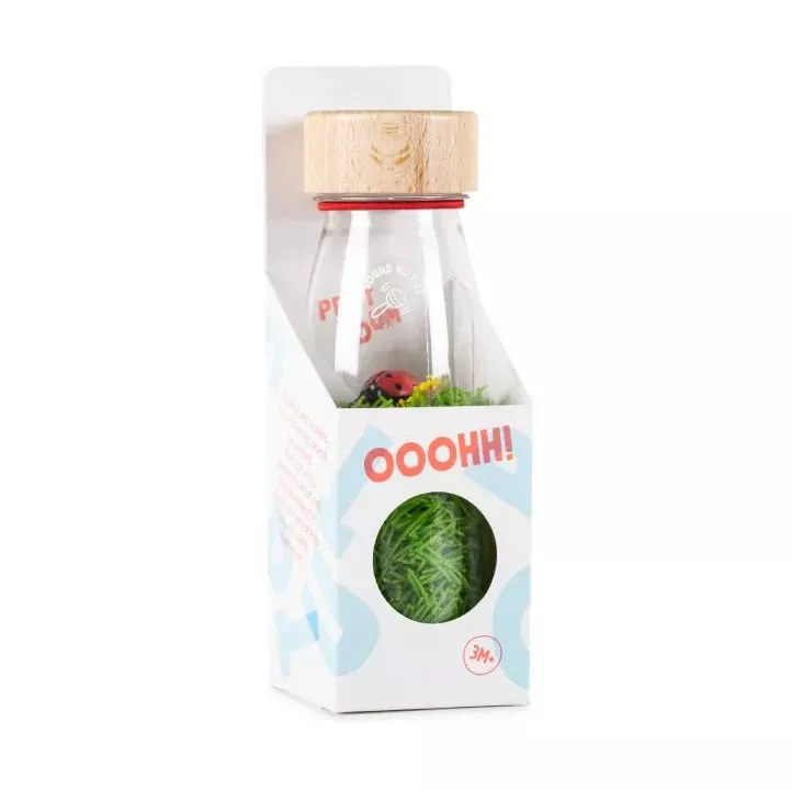 Petit boum Sound Bottle Ladybirds ist eine sensorische Flasche, die mit Gras und Marienkäfern gefüllt ist. Schütteln, zuhören und zuschauen.