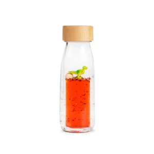 Entdecken Sie die Move Bottle T-Rex von Petit Boum – eine einzigartige sensorische Flasche mit einem schwebenden Dinosaurier.